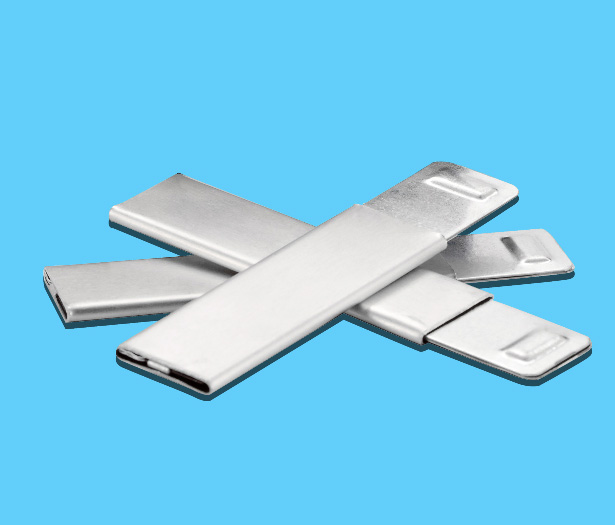 Five silver USB flash drives arranged overlapping on a blue background.