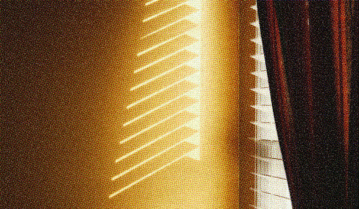 In the corner of a room, the blinds on a window are half-opened, and a curtain is drawn back slightly. You can see the shadow of the blinds on the opposite wall.