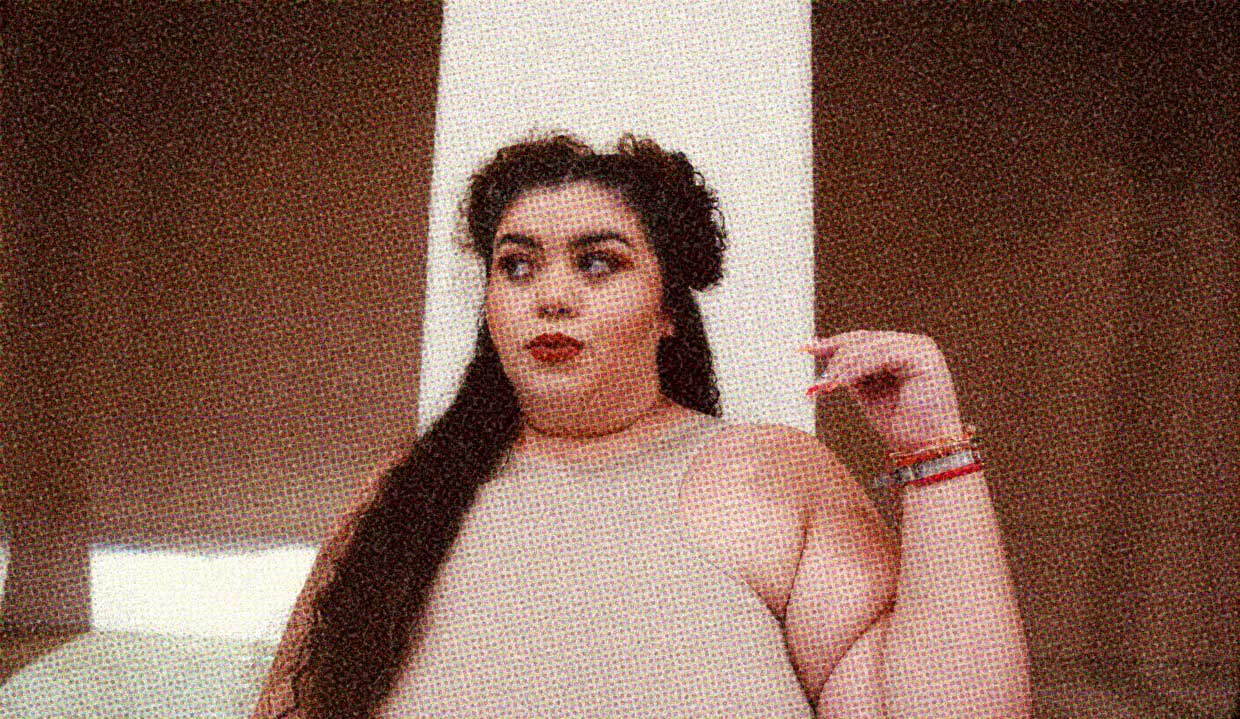 A woman with long hair side-eyes someone off-screen. The ghost of boyfriends past, perhaps?