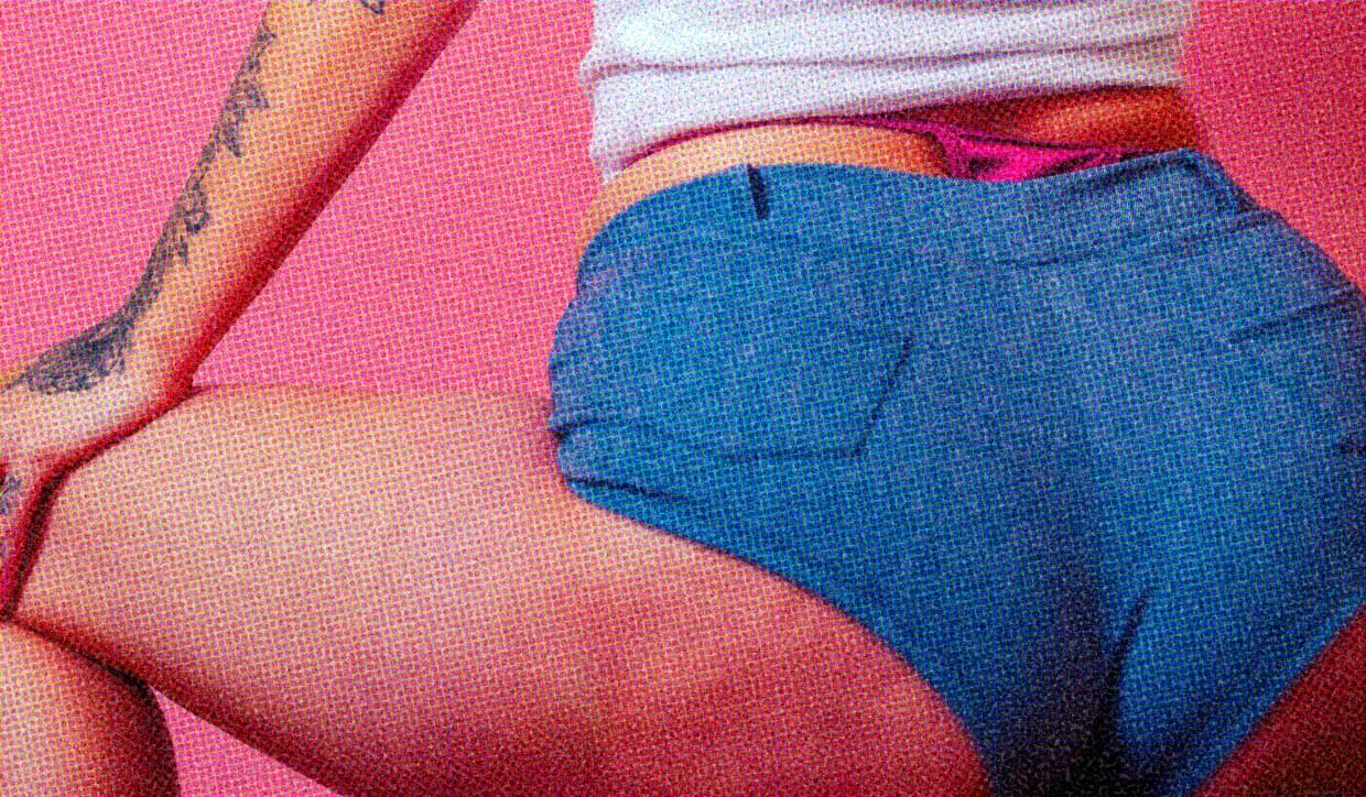 A close-up of a woman wearing booty shorts.