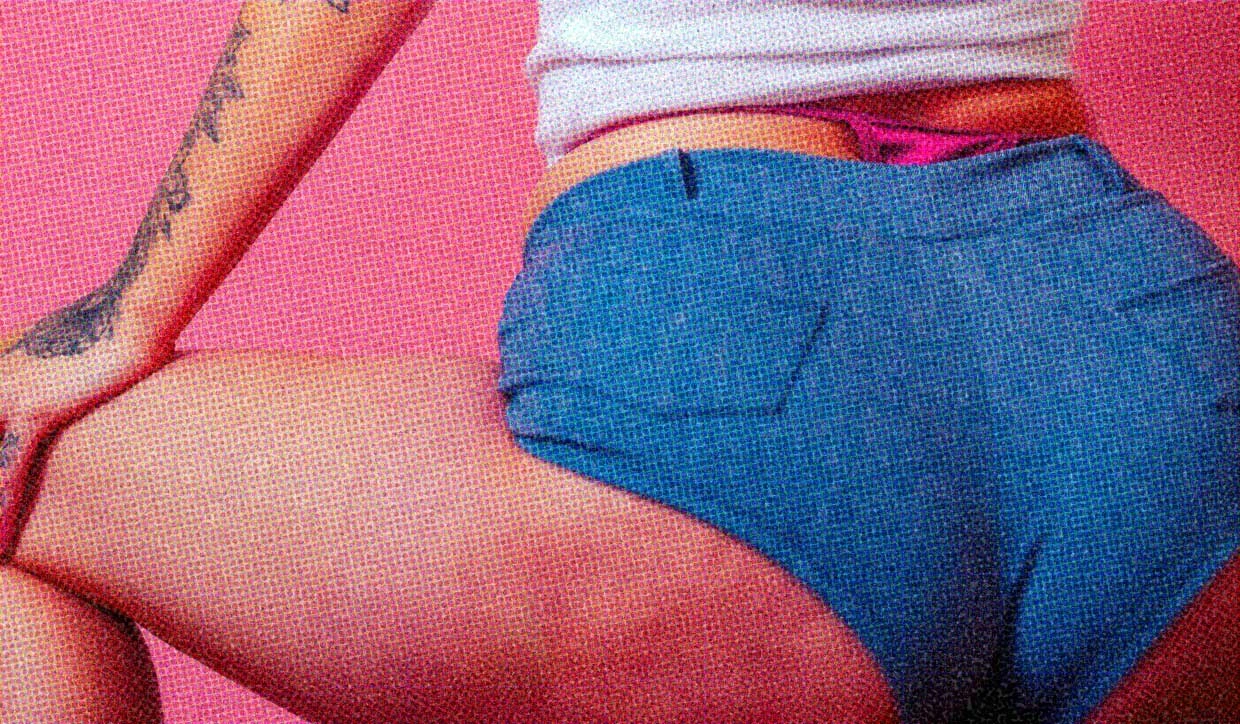 A close-up of a woman wearing booty shorts.