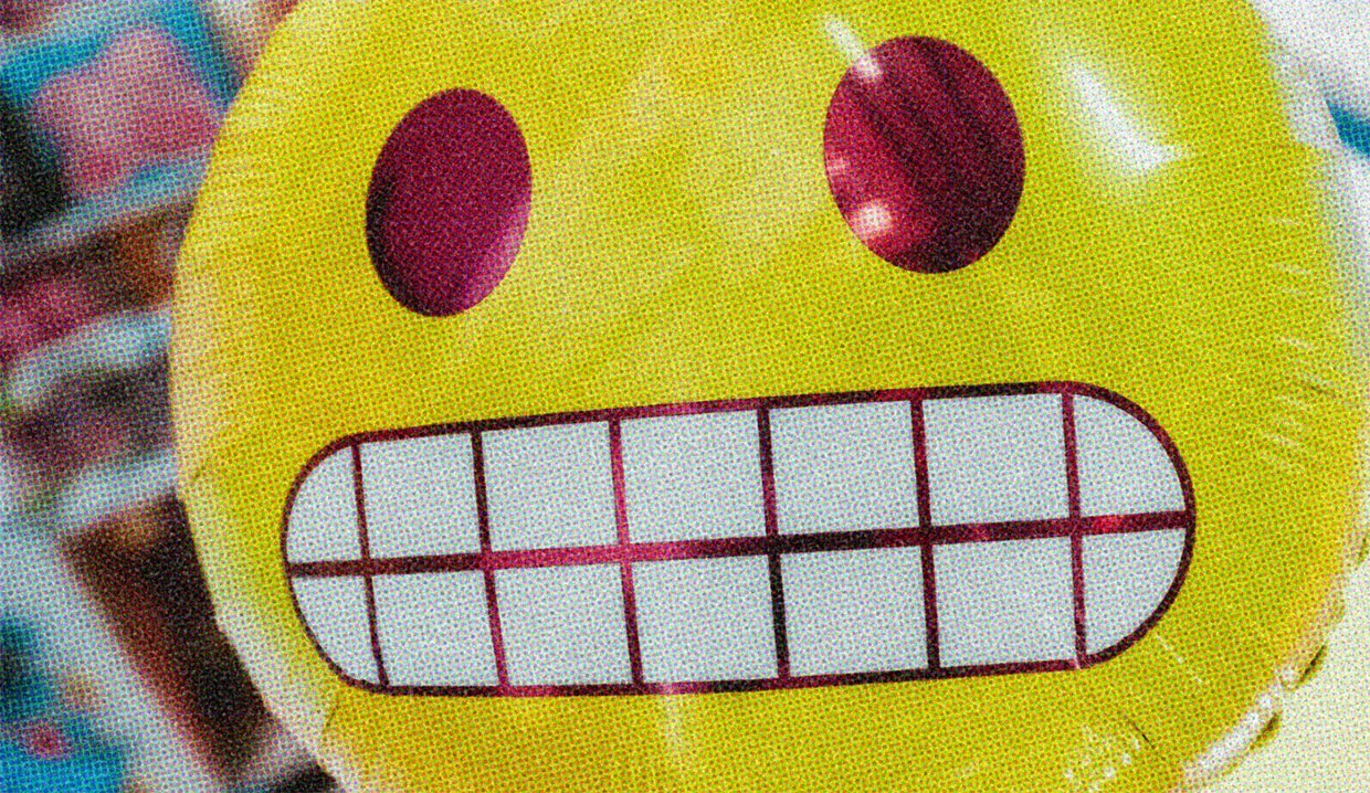 Giant yellow balloon with a cringe expression, floating in front of the camera.