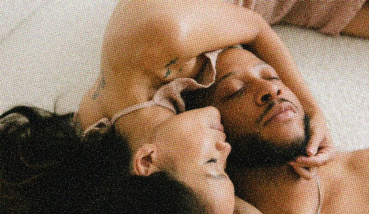 HUD App - couple cuddling lying on bed - Should you sleep with your ex