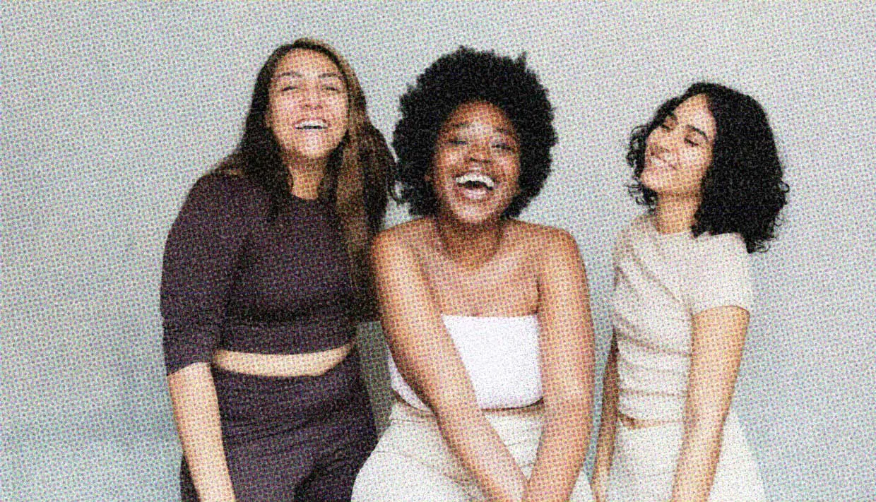 Three women sit close together. Are they a polycule? 
