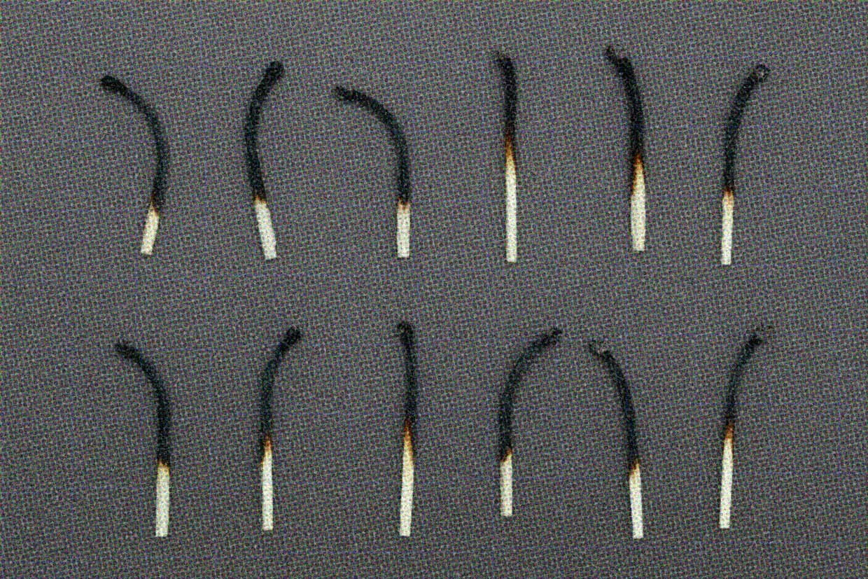 12 burned matches in two neat rows.