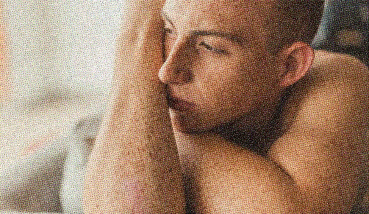 A person looks contemplatively off into the distance.