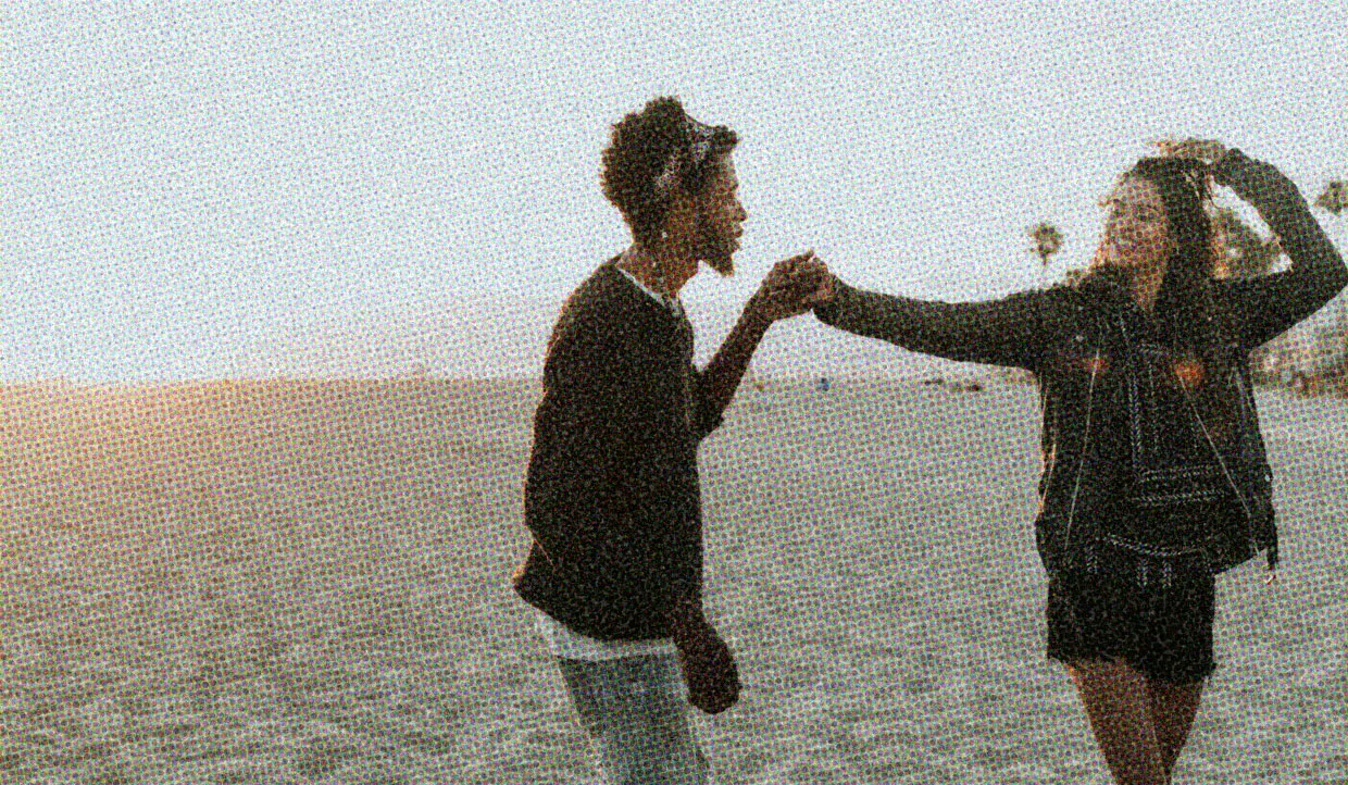 HUD App - Couple dancing on beach - What is New Relationship Energy