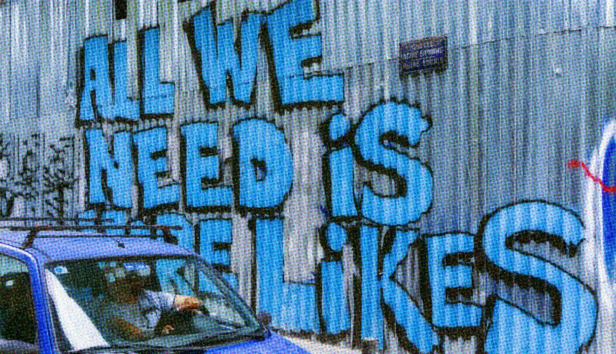 HUD App - Graffiti saying all we need is likes - Social media making you unhappy