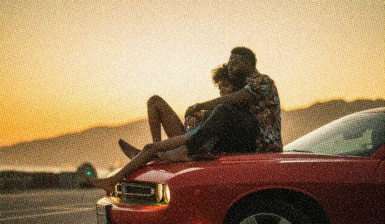 HUD App - Couple cuddling on car hood - Summer fling