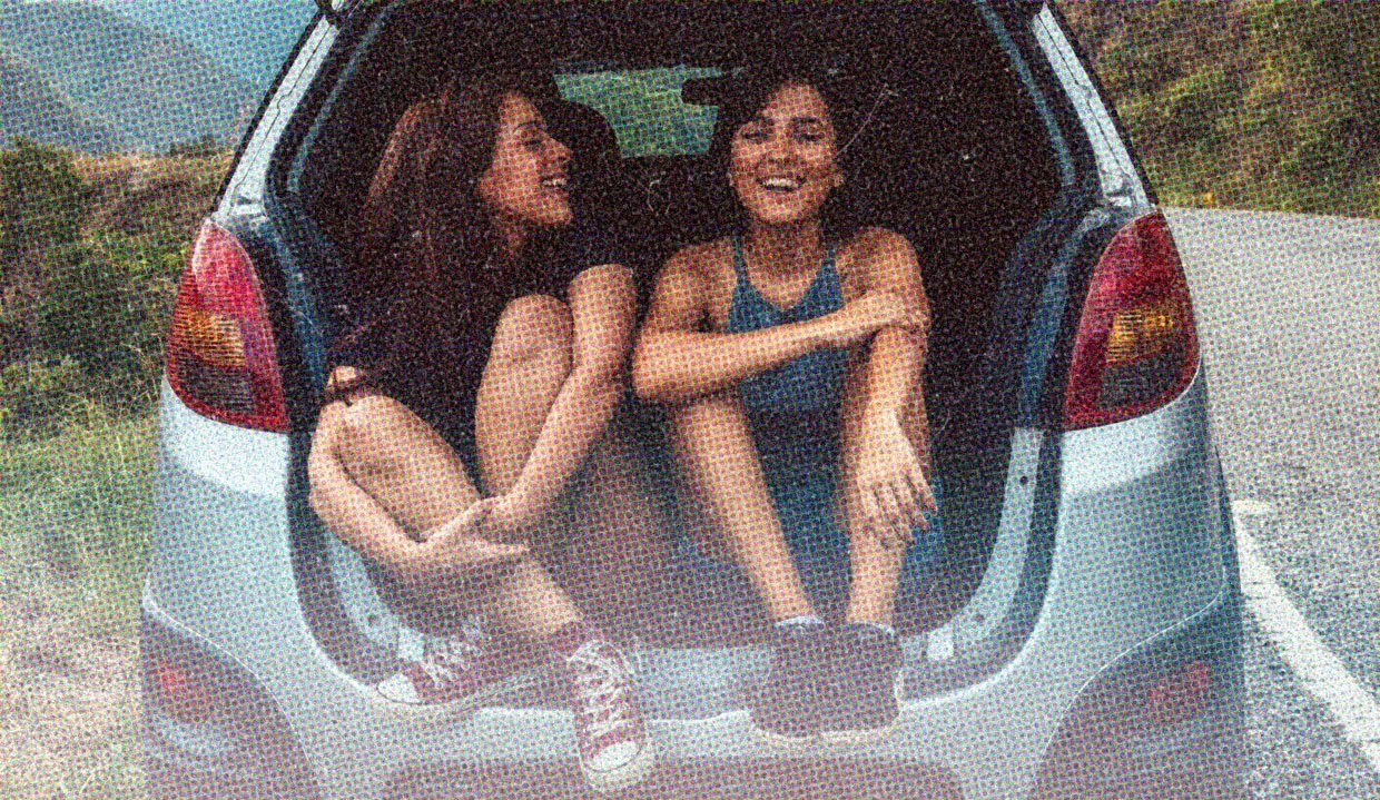 HUD App - Two women sitting in trunk of car - First date questions that spark conversation