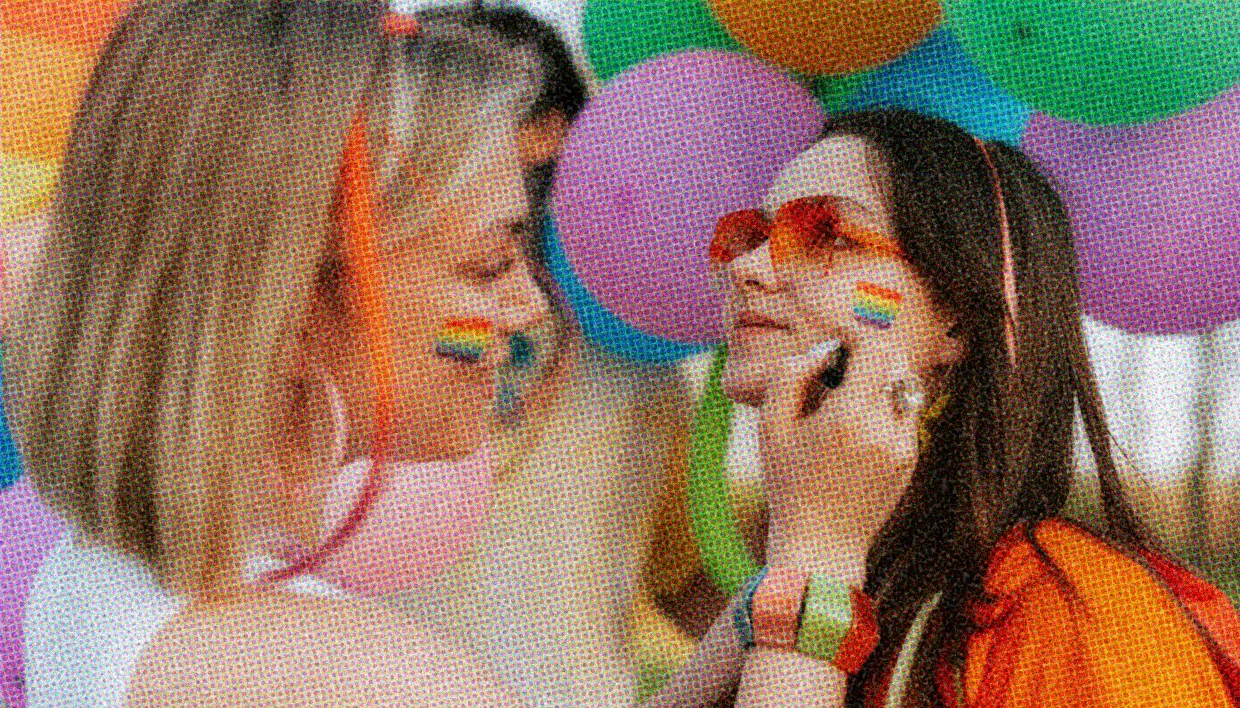 HUD App - Two women with rainbow flag face paint - How to support LGBT youth