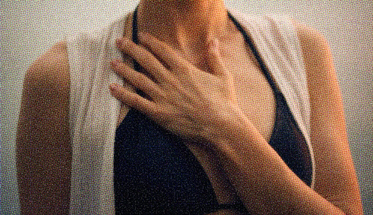 HUD App - Close up of women resting hand on chest - How to be kind to yourself