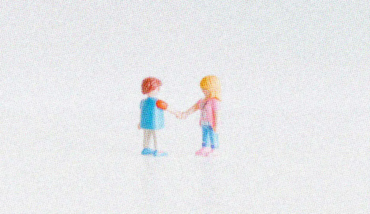 Two toy figurines are posed on a white background, shaking hands.