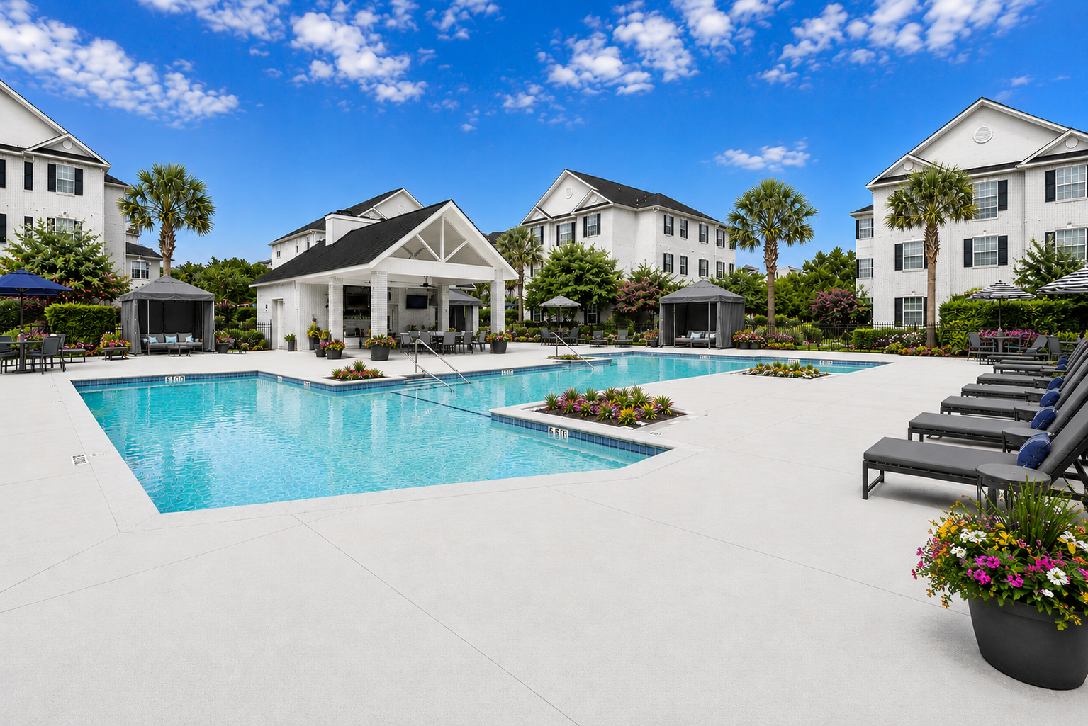sparklng pool with seating and lounge chairs