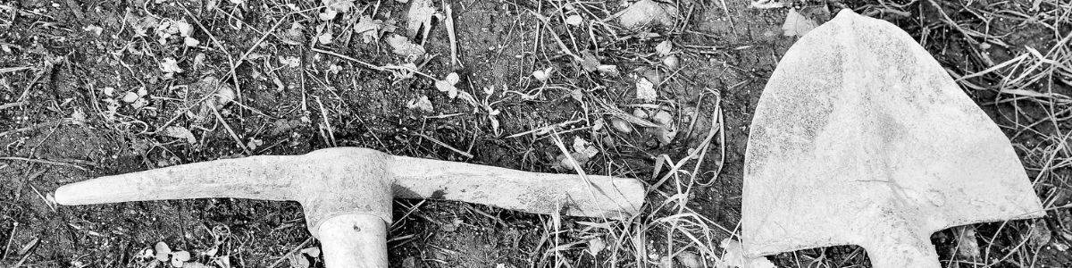 A pick next to a shovel signifying AI infrastructure investing known as AI Picks and Shovels Strategy