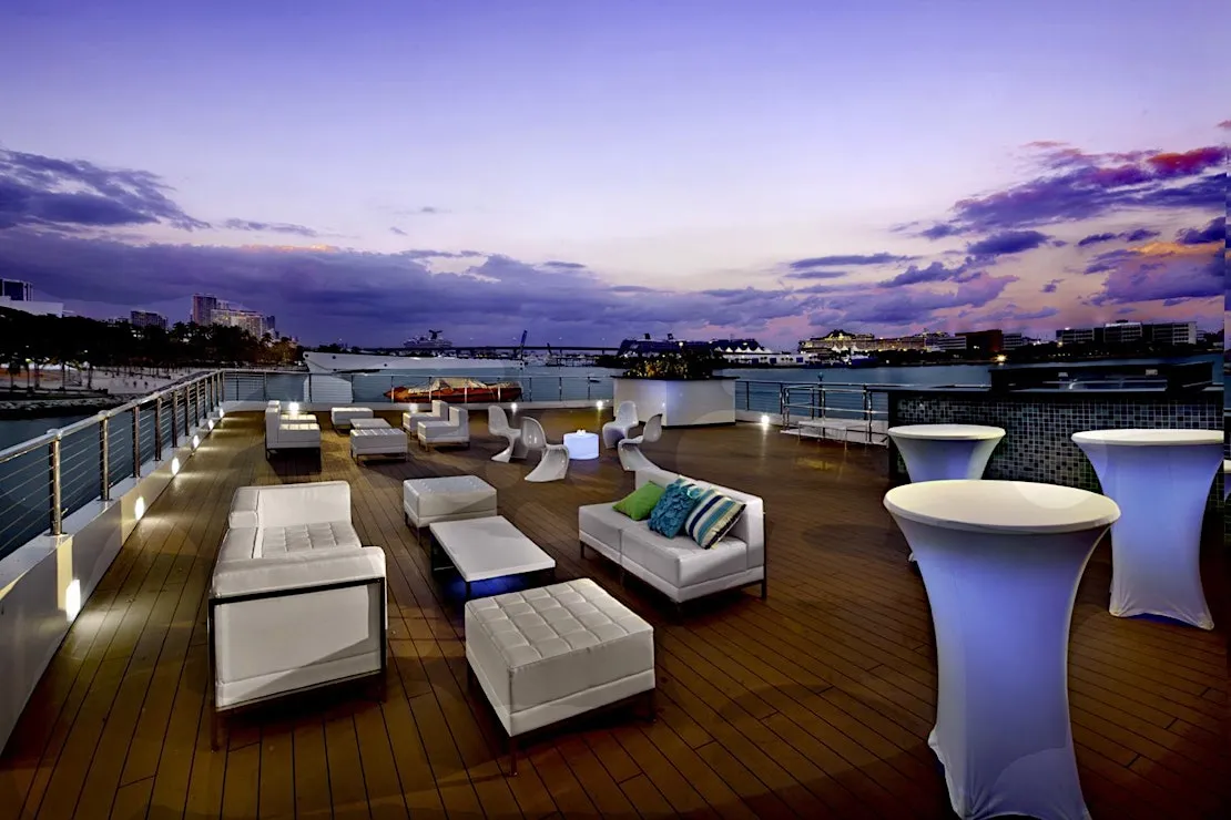 The Skydeck lounge at dusk above Biscayne Bay
