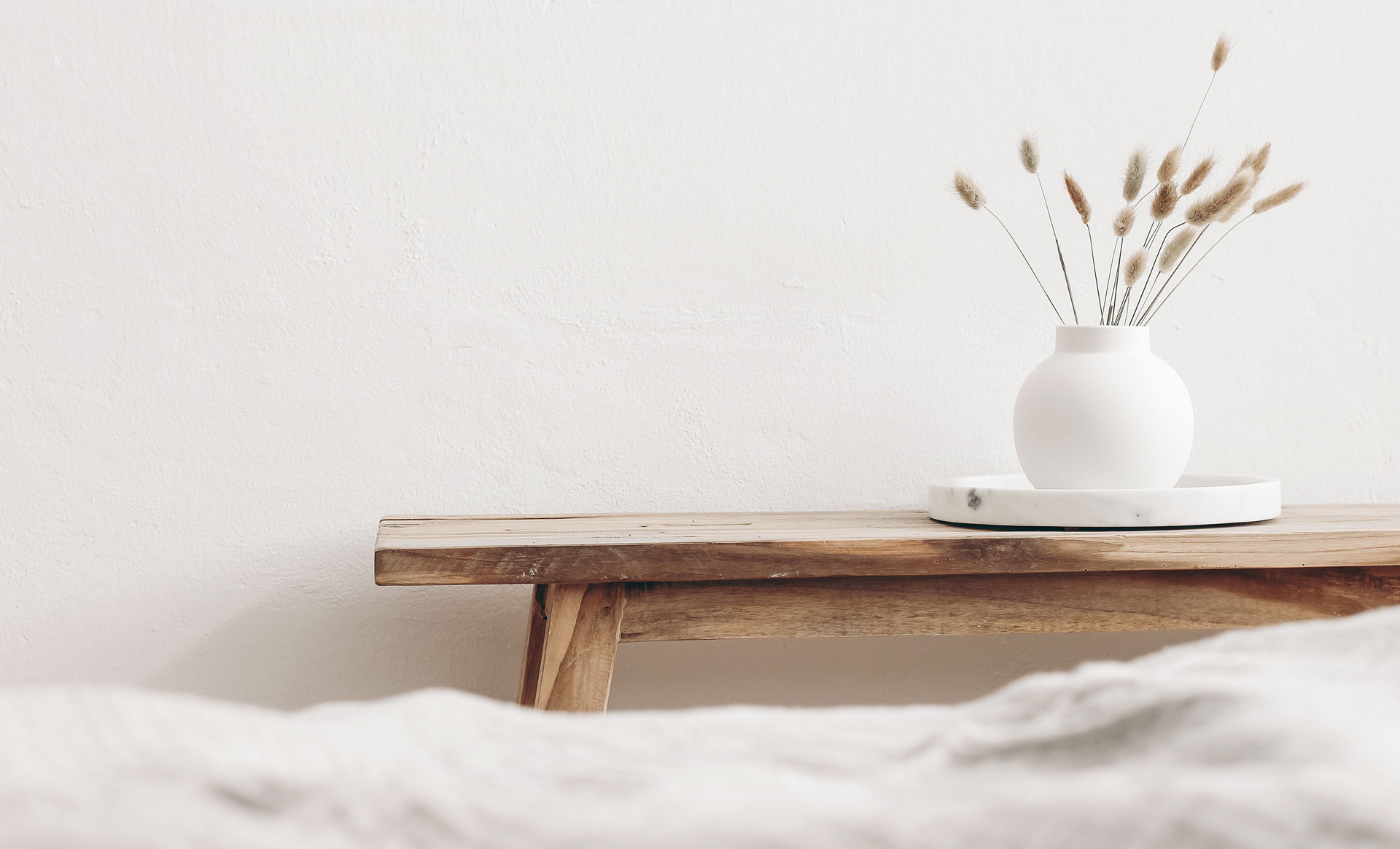 Wooden desk with minimal floral arrangement