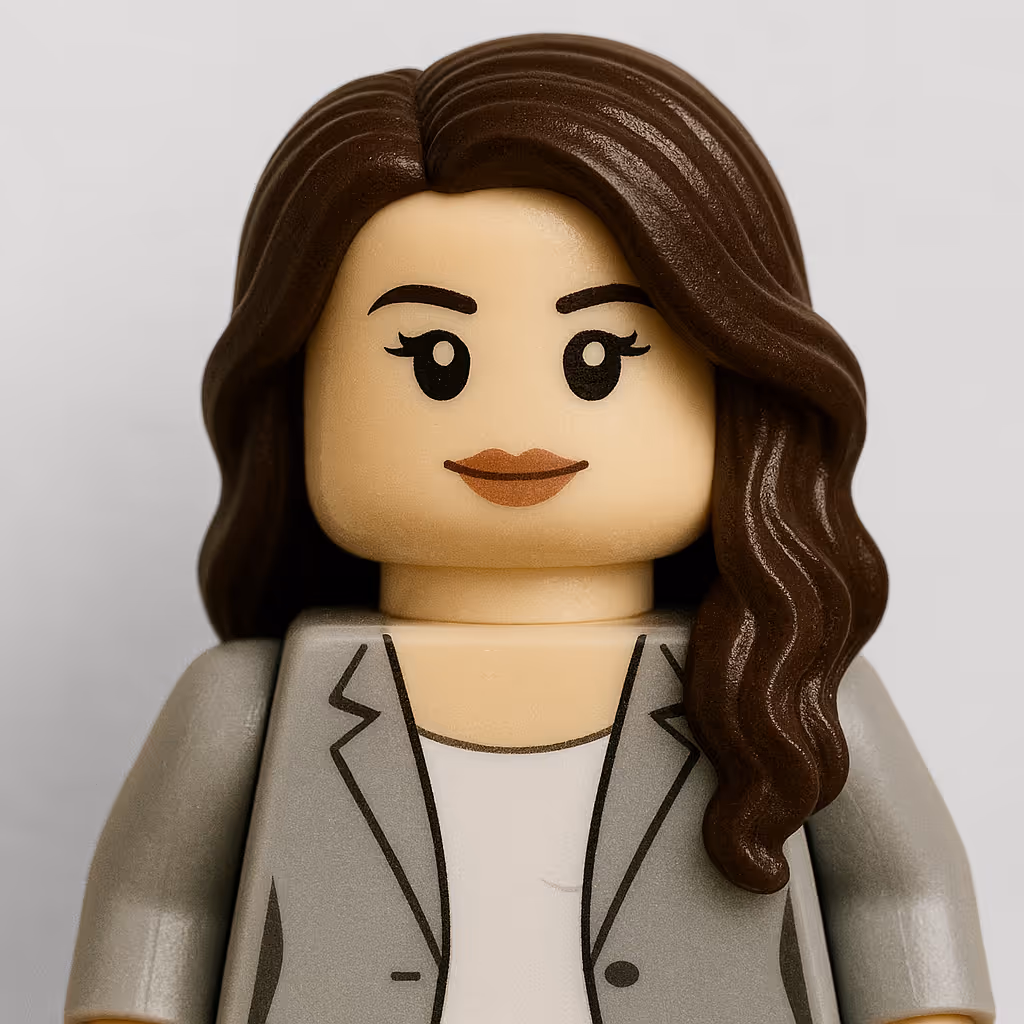 LEGO figure with long wavy brown hair, gray blazer, and white shirt.