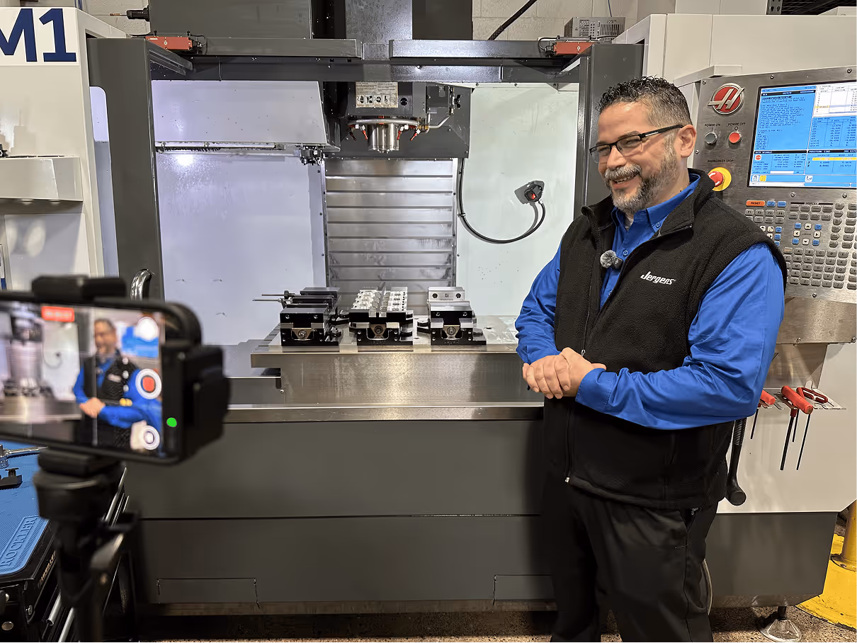 Man smiling on camera while being filmed