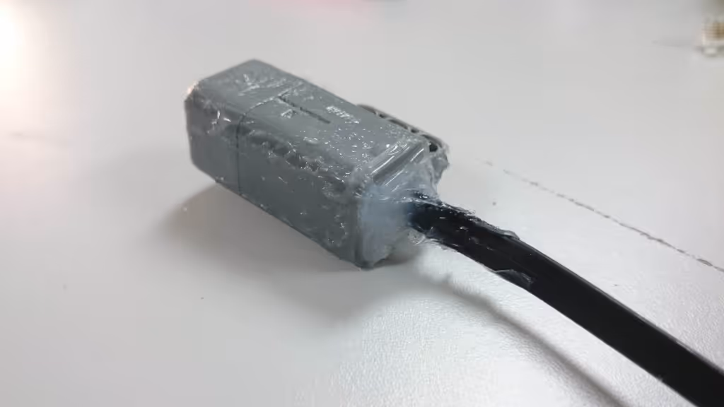 A sensor covered in silicon to seal the joins in the housing