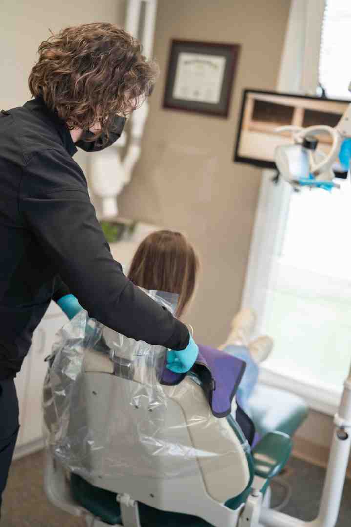 dentist carefully working on a patient's veneers - are veneers reversible dentist carefully working on a patient's veneers - are veneers reversible