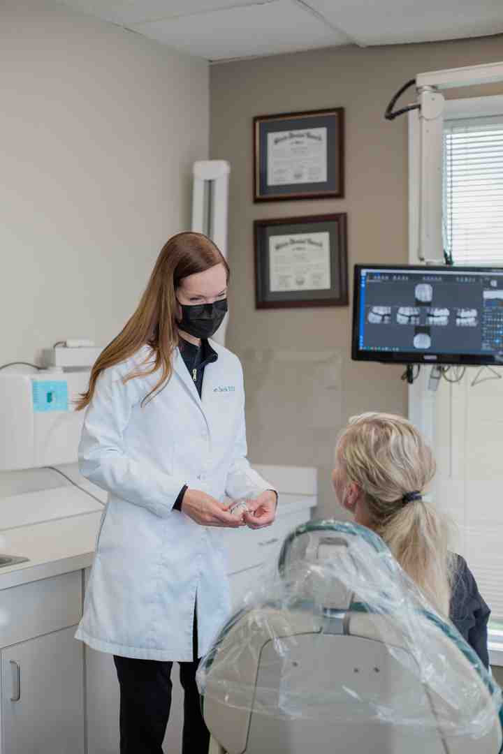 dentist consulting with patient - Payment plans for veneers