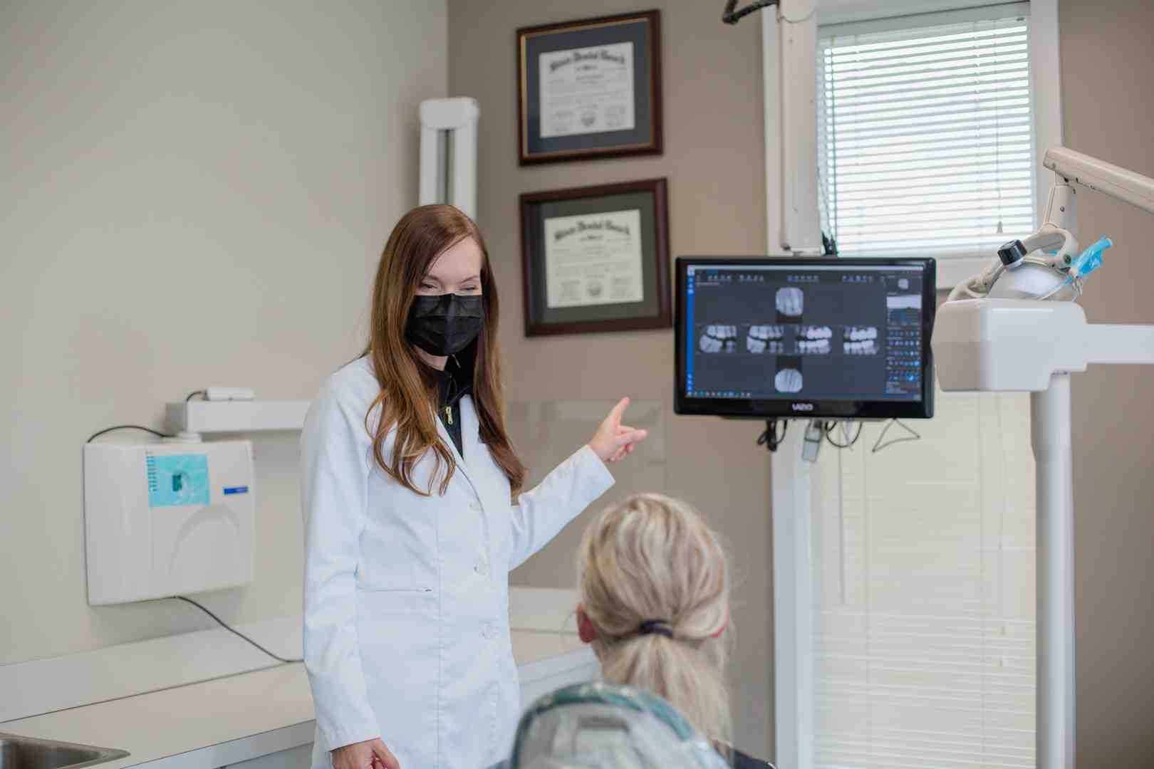 infographic showing the breakdown of total veneer costs including per-tooth pricing for porcelain and composite veneers, full set costs for 8 teeth, additional expenses like consultations and X-rays, temporary veneers, custom nightguards, and long-term maintenance costs, with a comparison of lifespan between porcelain and composite options - Tooth Veneer Cost