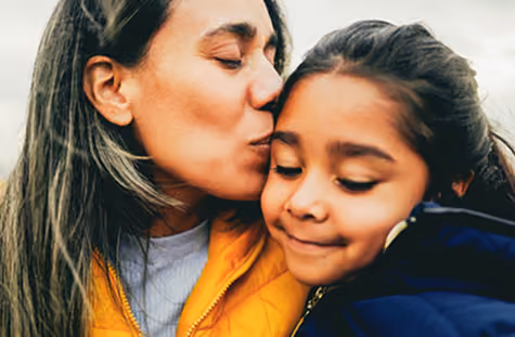 A mother embracing here child