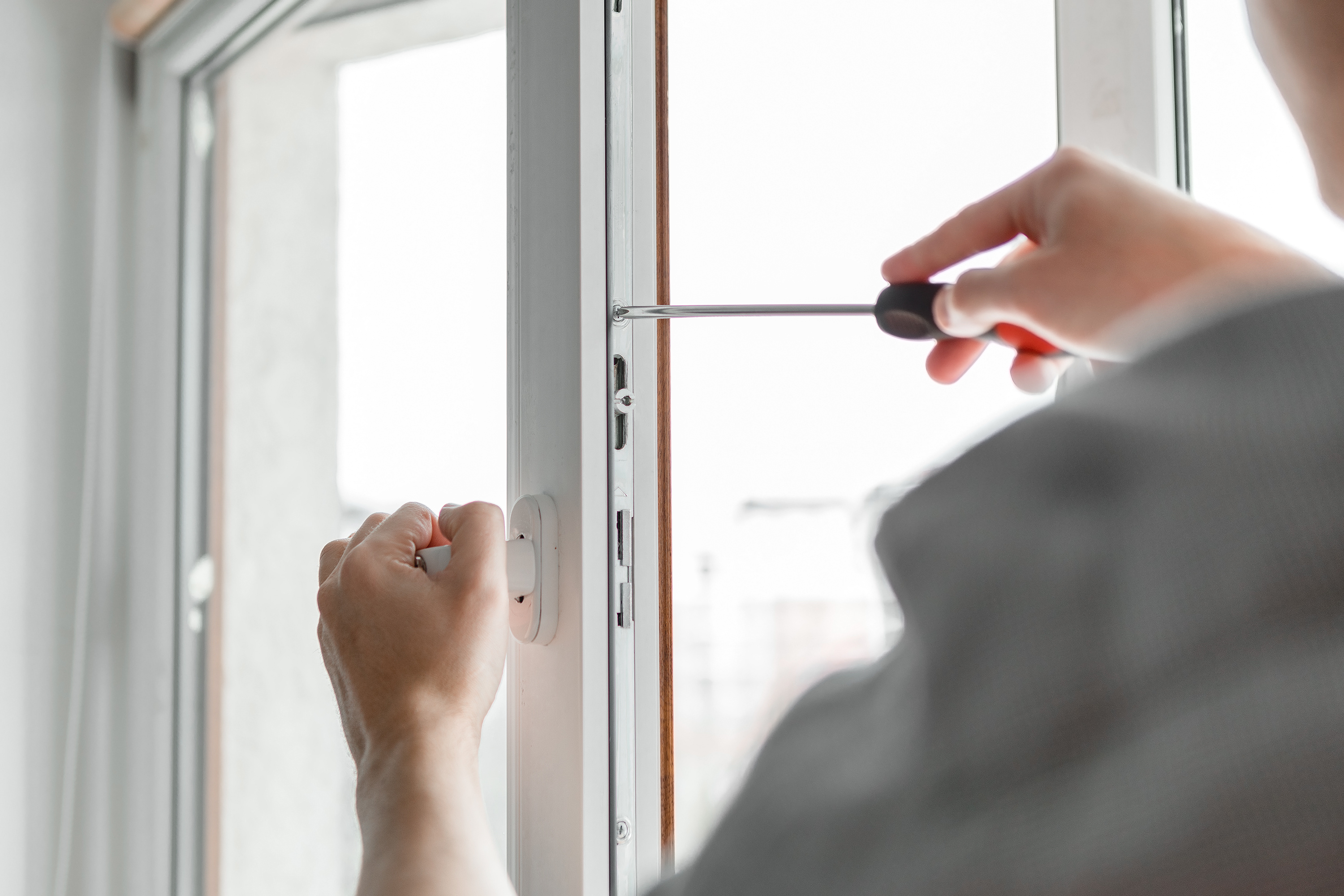 Home services contractor installing a window, Maryville TN