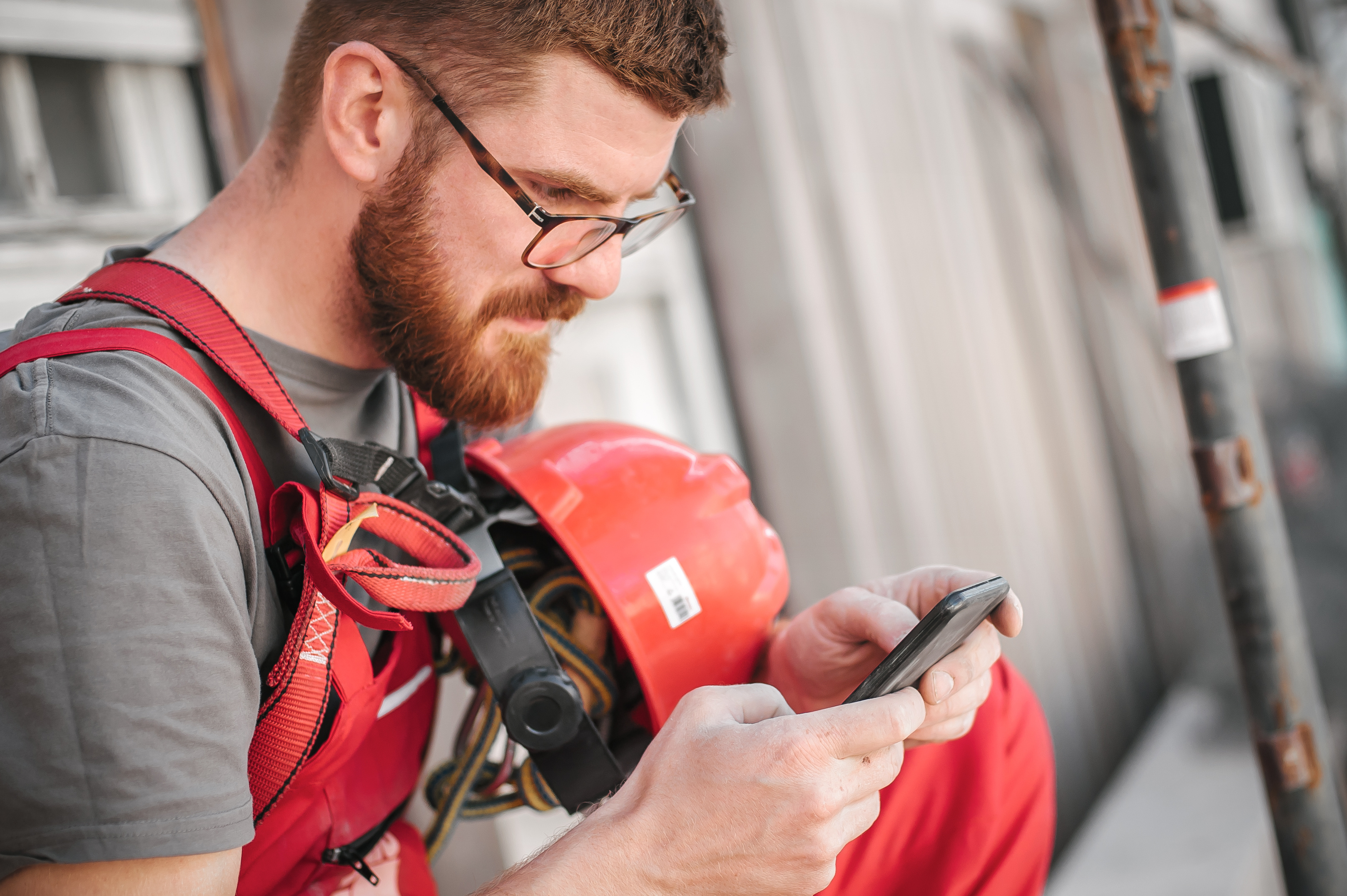 Contractor using smartphone to search online, Blount County TN