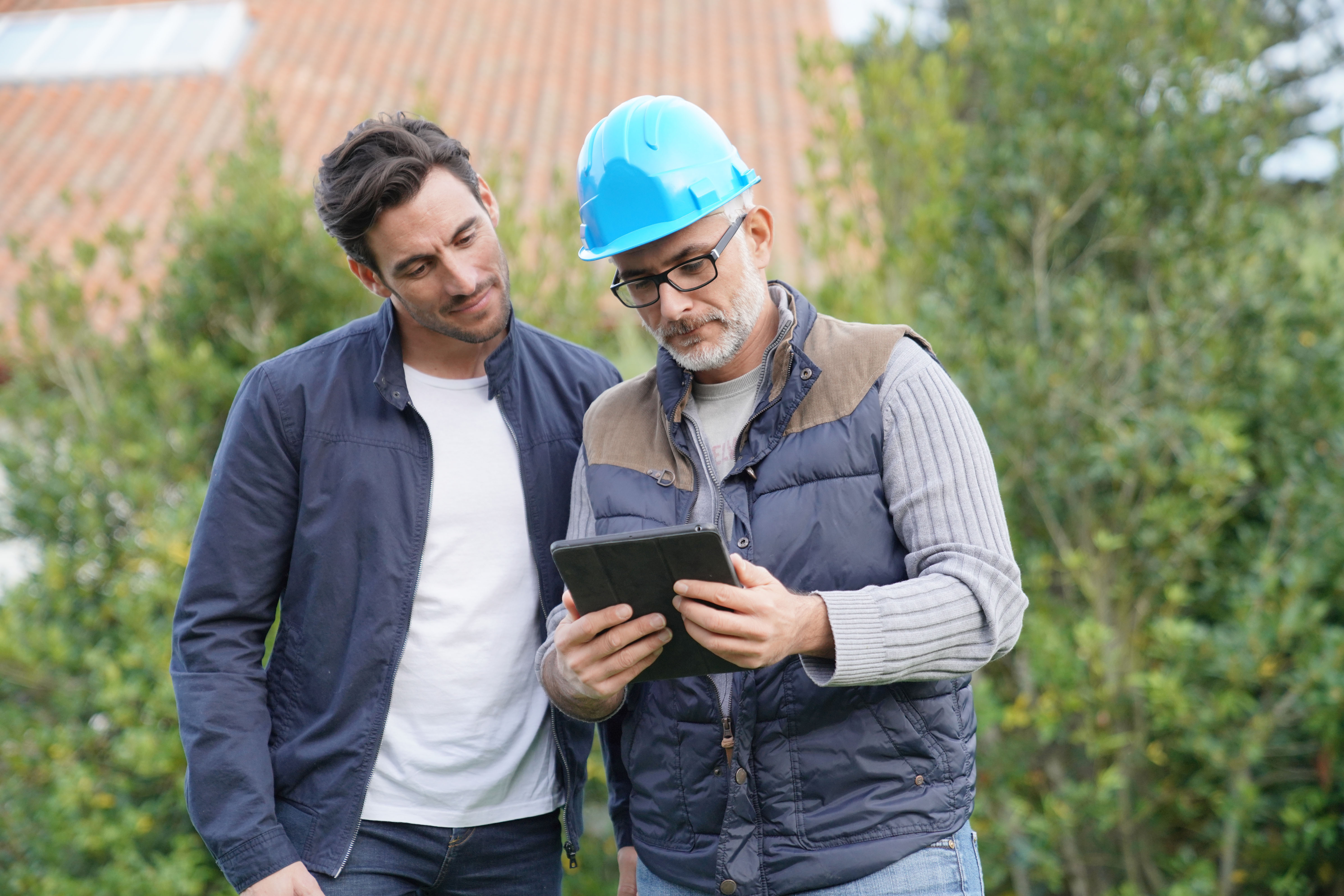Home services contractor transparently reviewing project pricing and plans with a homeowner in Lenoir City, Tennessee