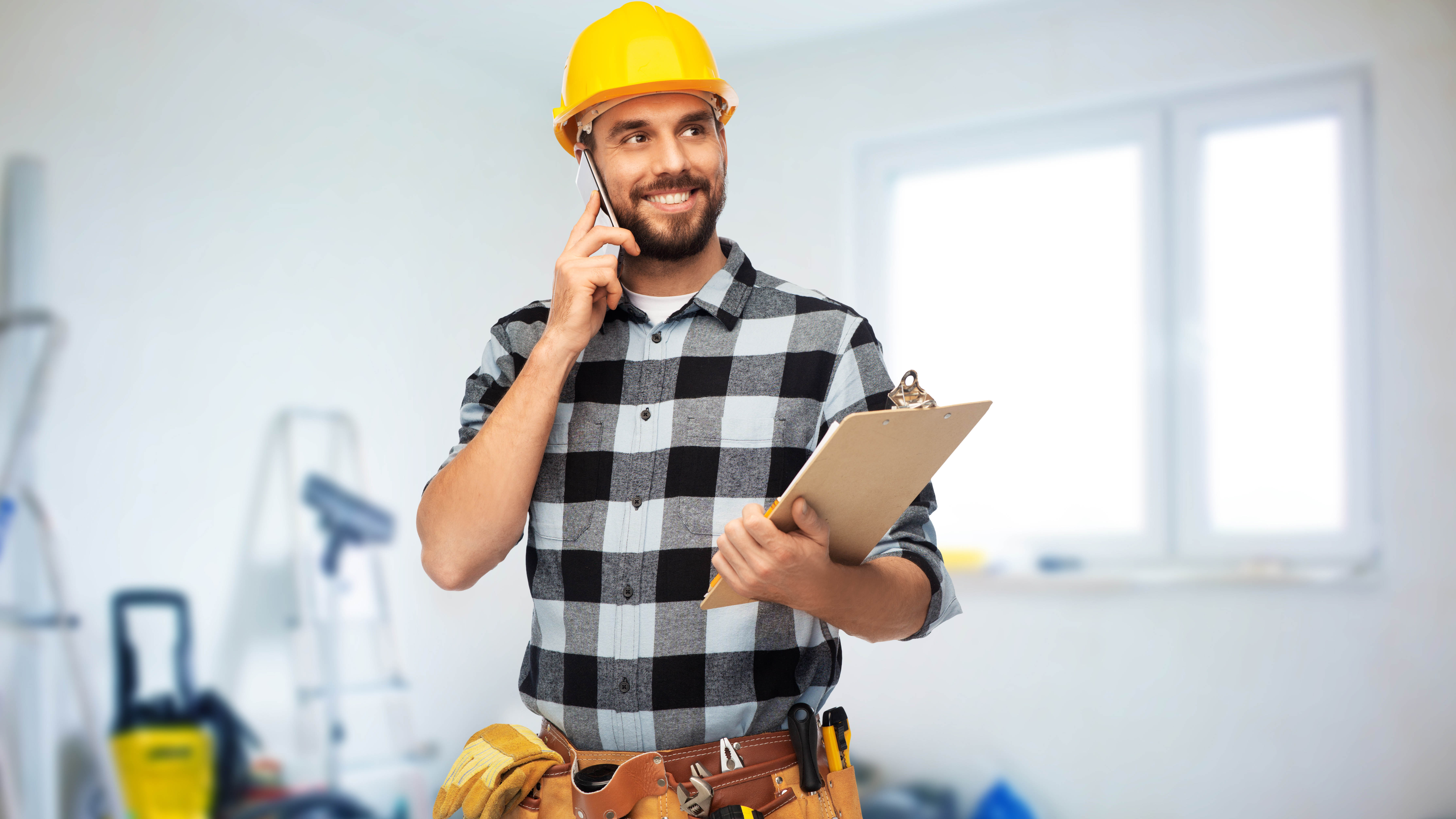 Home-services contractor taking a phone call on a job site, representing booked-job leads from Google Local Service Ads in Cleveland, Tennessee