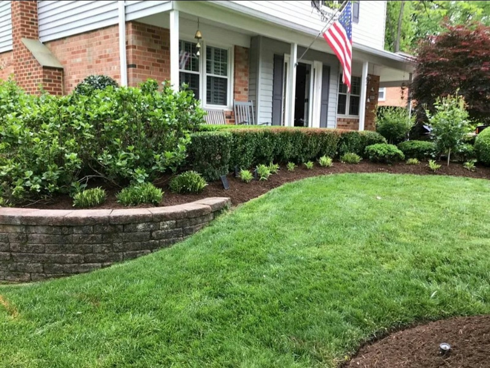Home with a manicured lawn and landscaping in Alcoa