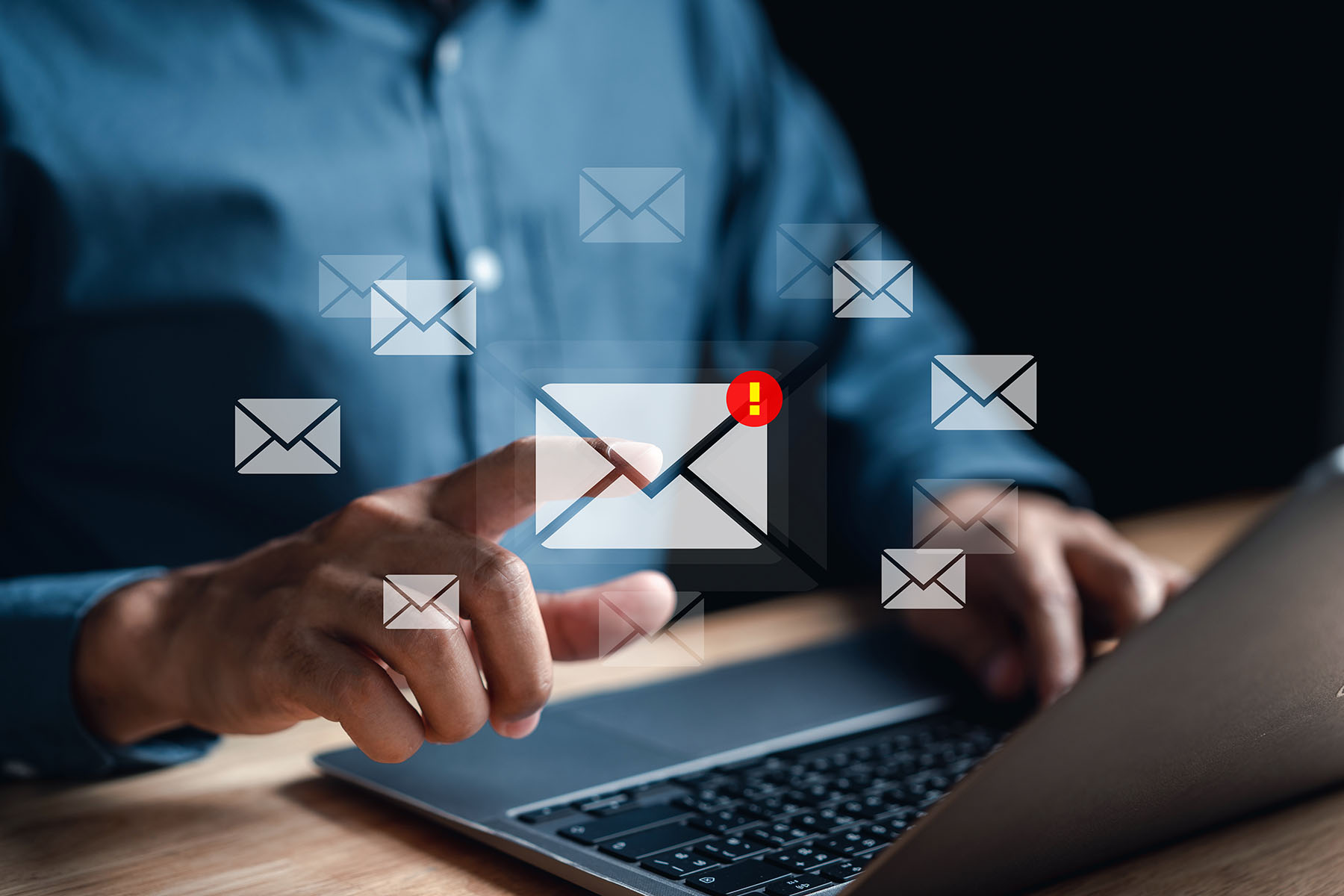 Email marketing icons above a laptop keyboard