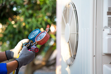 Maryville HVAC technician checking a compressor unit and Google Business Profile local marketing