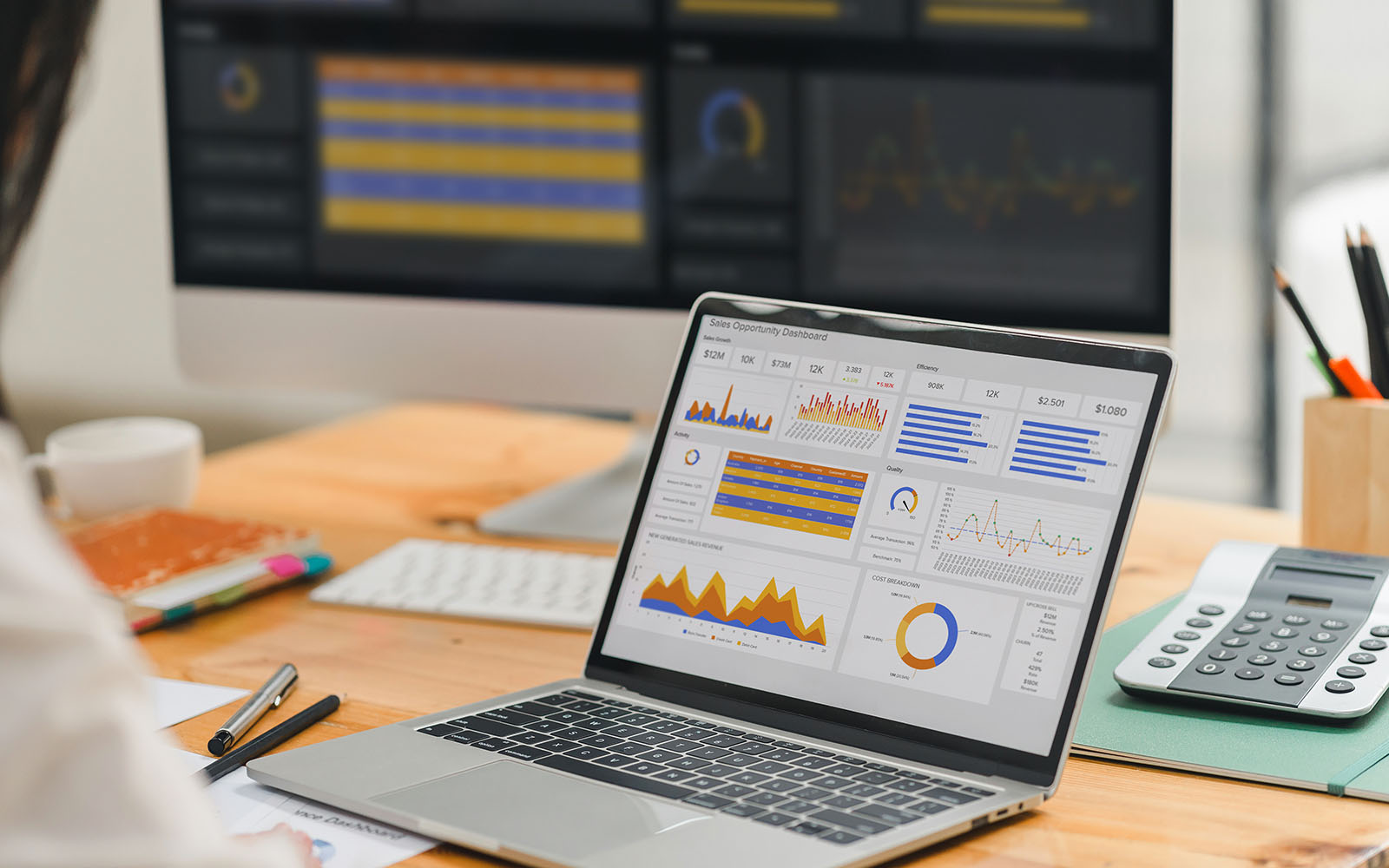 Marketing analytics dashboard open on a laptop at a small business desk in New Port Richey East, Florida