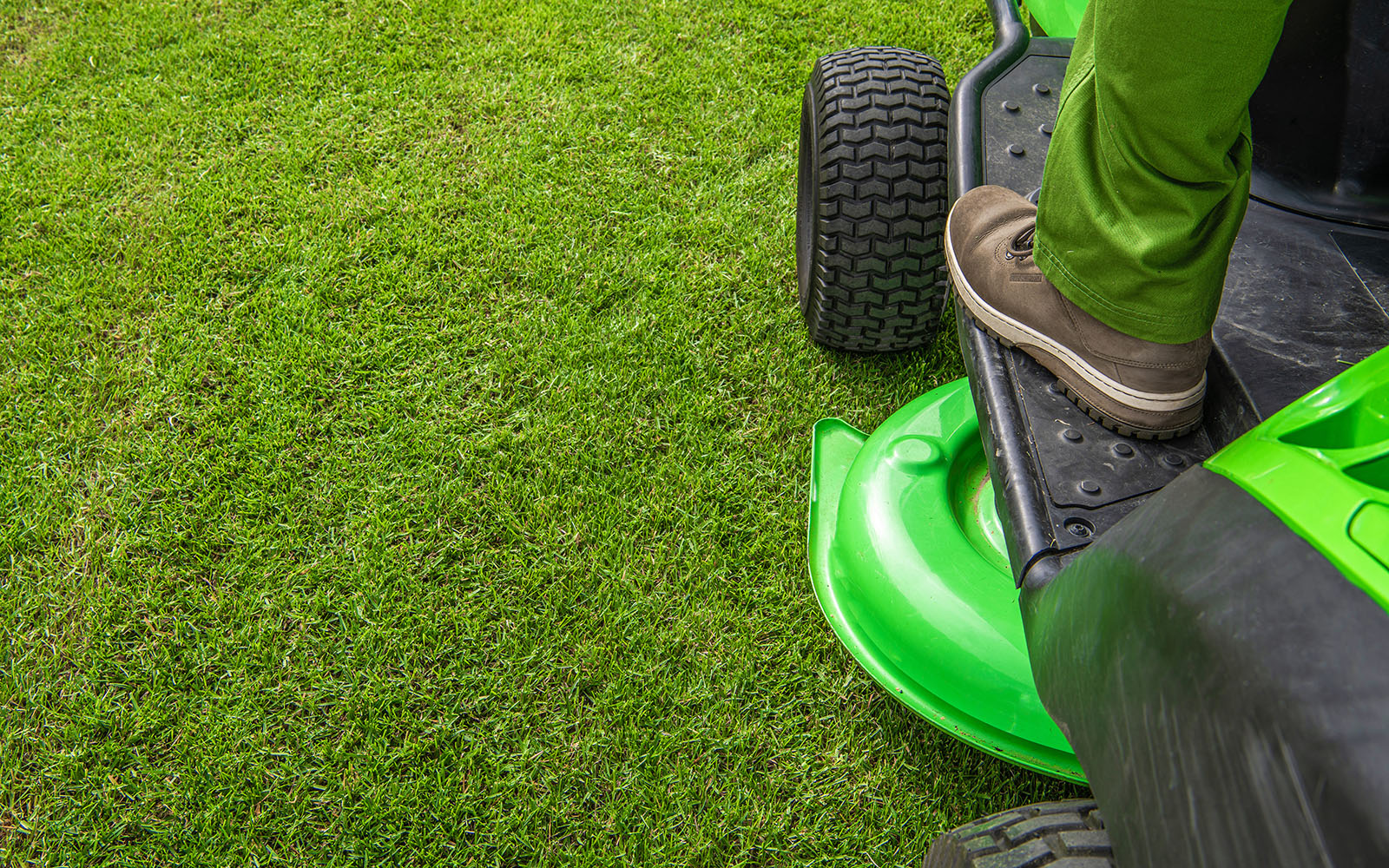 Landscaping crew mowing a residential lawn in Sevierville, Tennessee