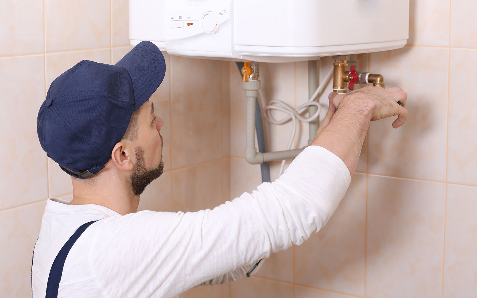 Plumber installing a water heater at a home in Kingsport, Tennessee
