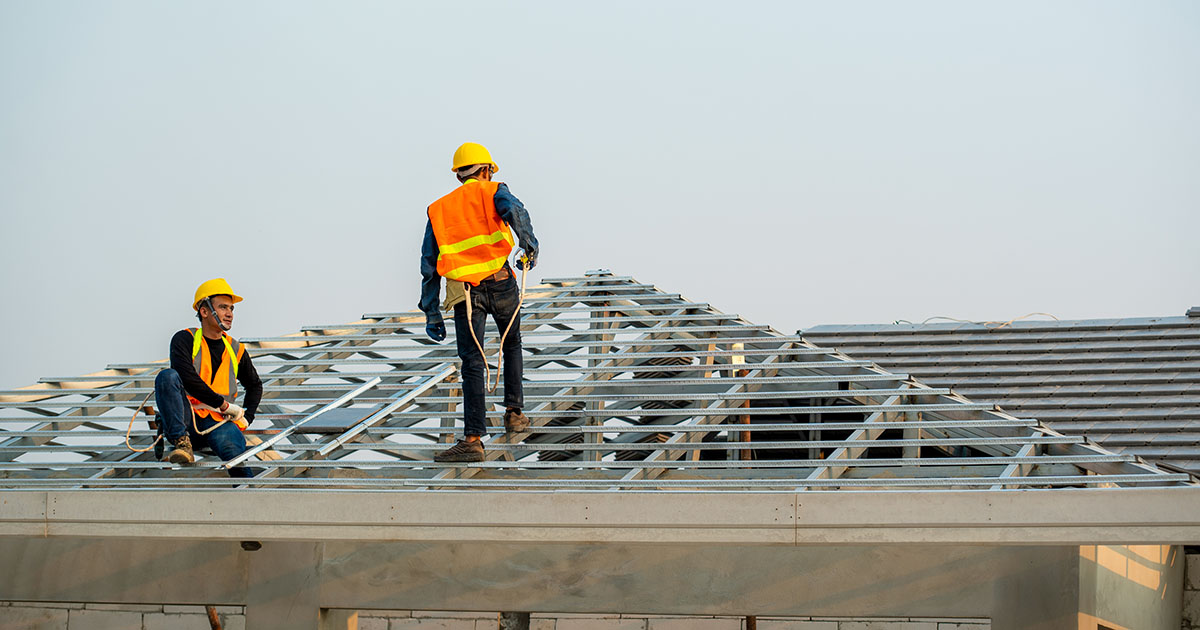 Roofing crew working on a residential roof
