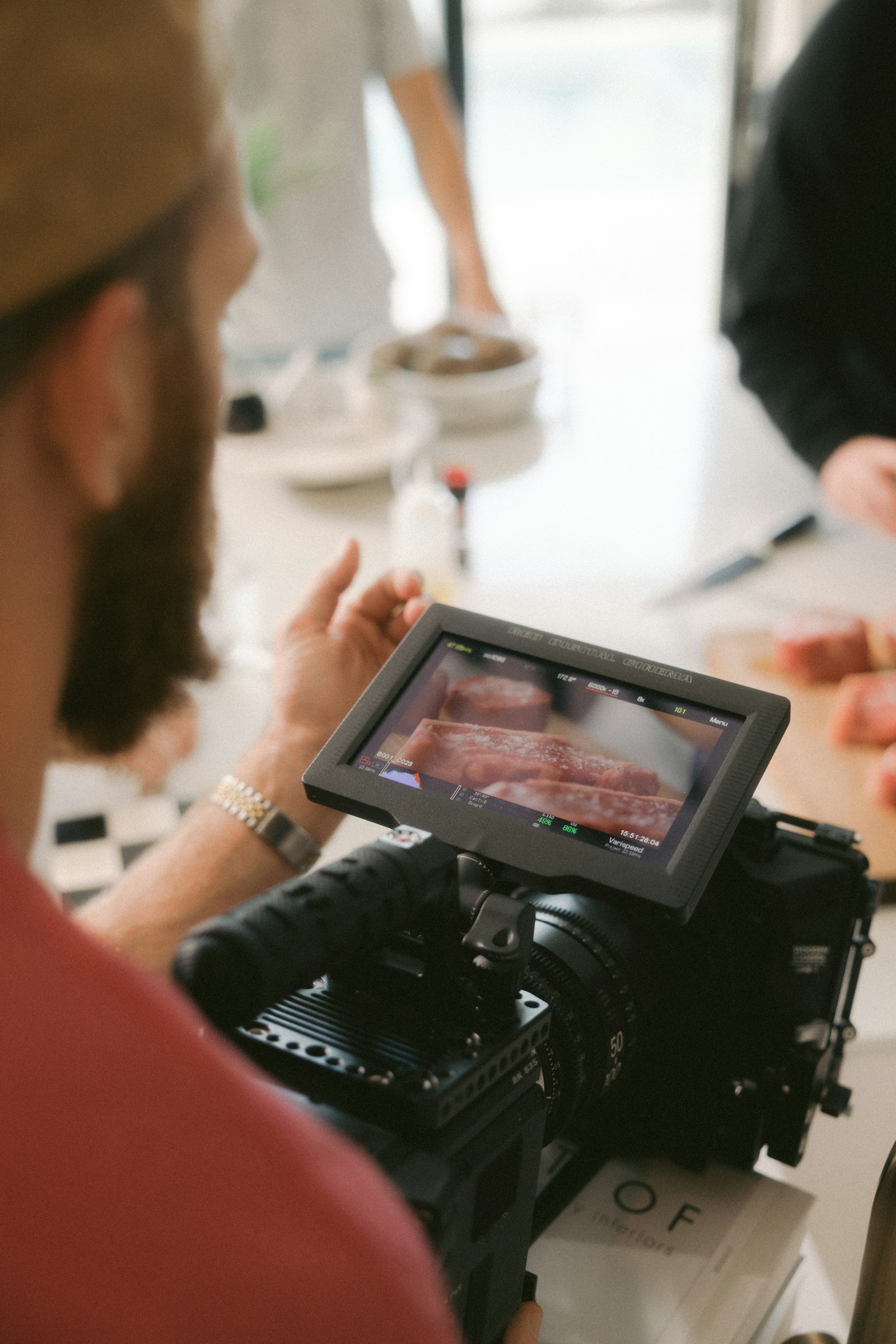 Videographer filming a commercial with a camera