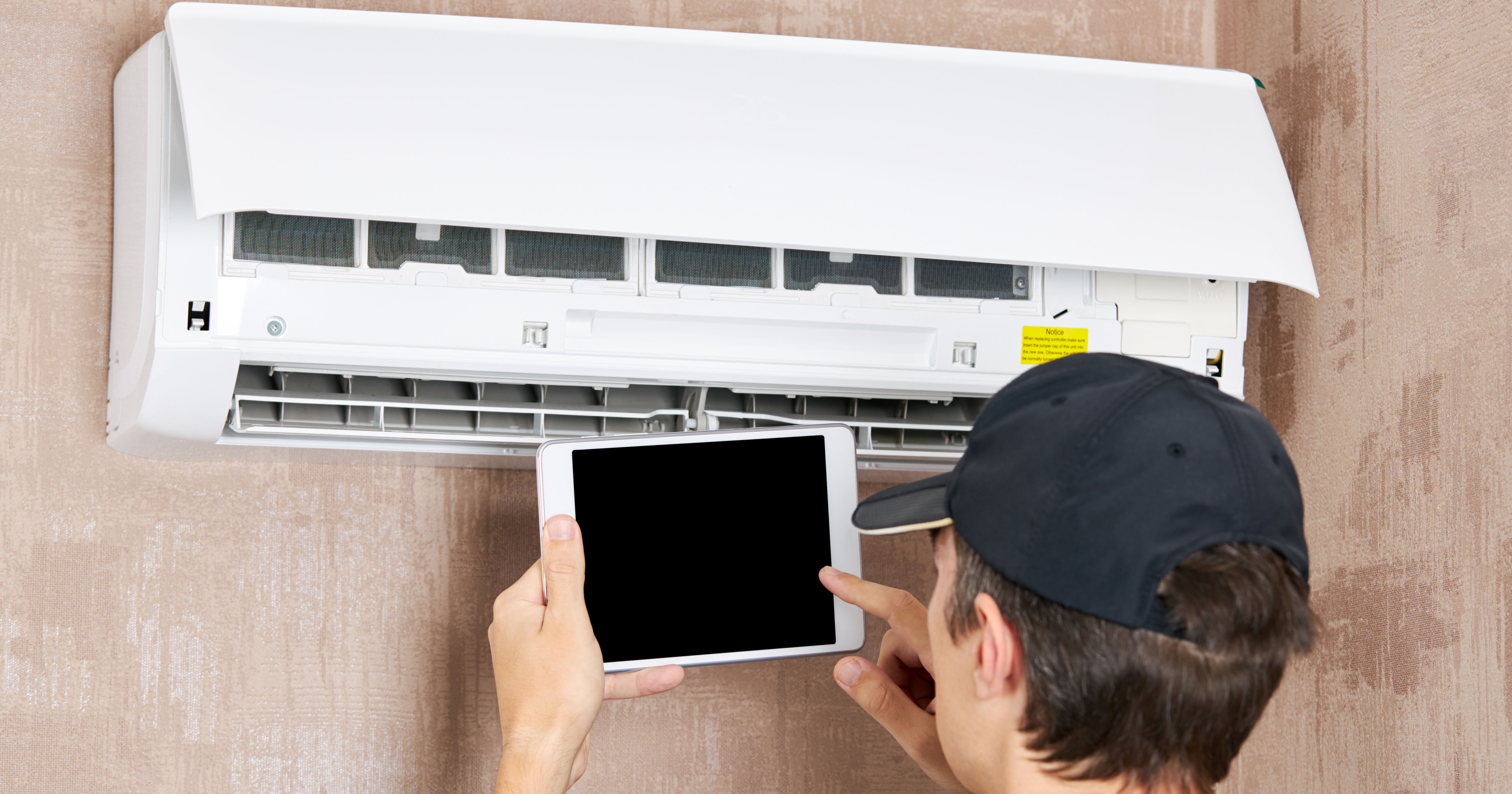 Service technician diagnosing an air conditioner — winning the Google Map Pack for Oak Ridge HVAC