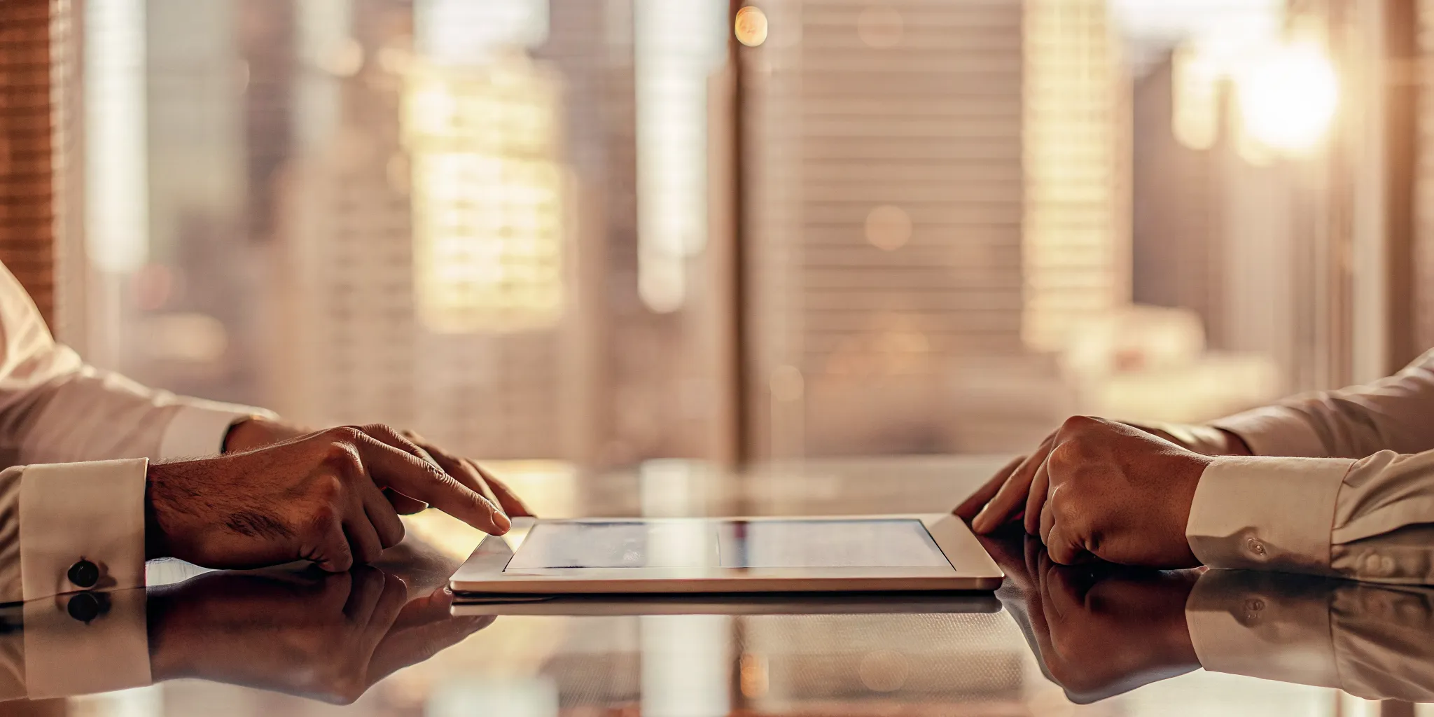 Two people reviewing unsecured installment loans with no credit check on a tablet.