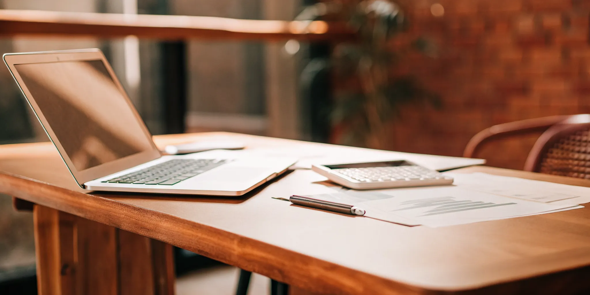 Using a loan calculator on a laptop to understand loan payments.
