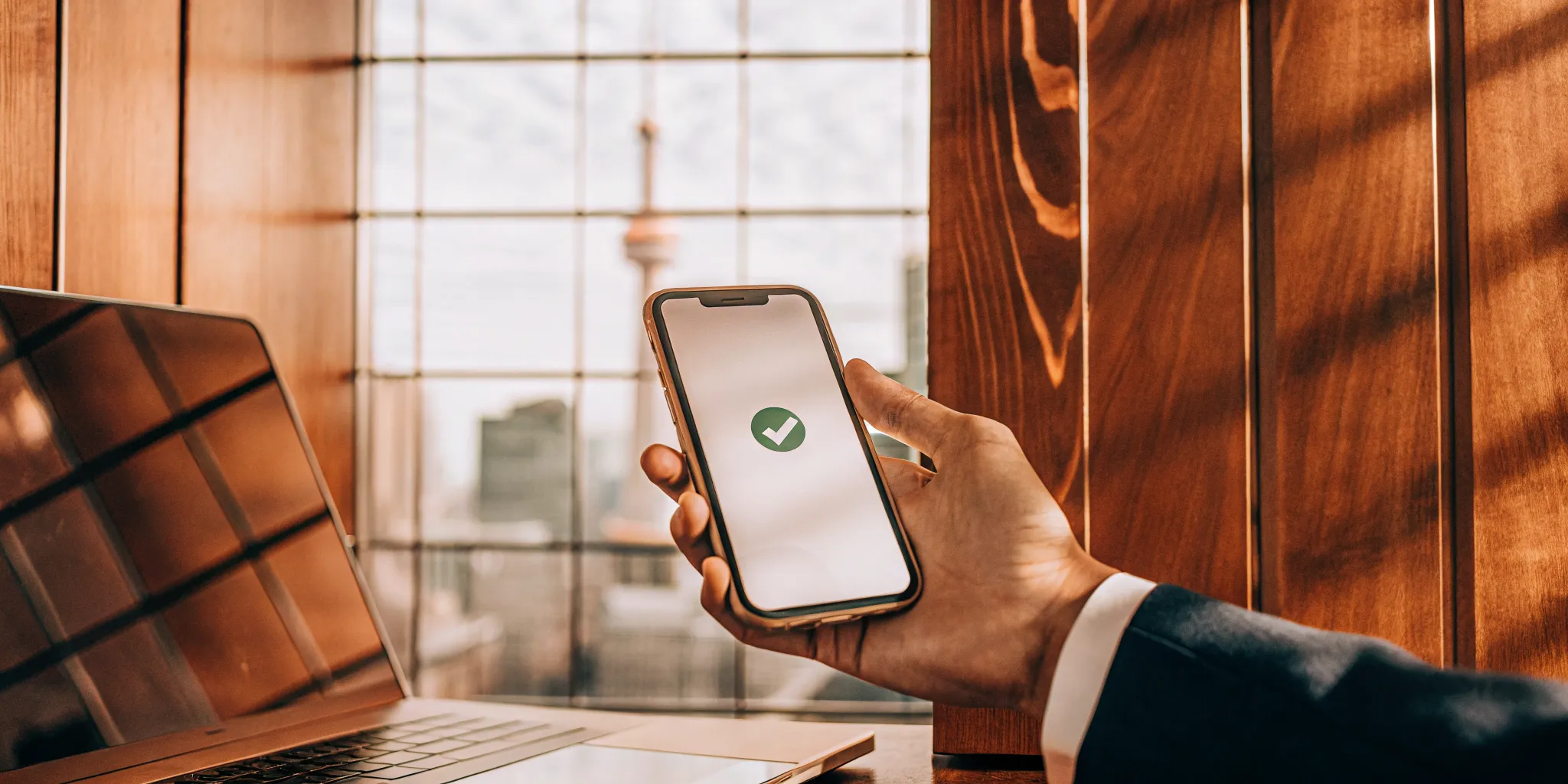 A person receiving fast funding approval from Loans Canada on their smartphone.