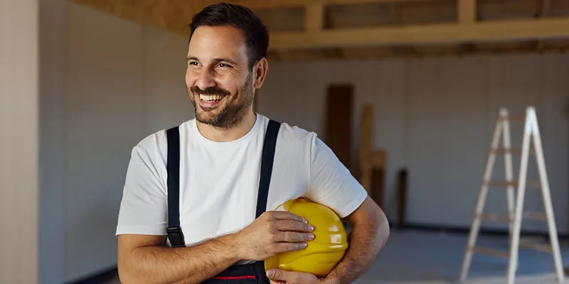 a business owner smiling after successfully applying EOFY tax deductions