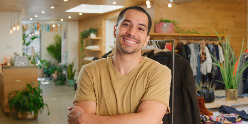 Retailer and ecommerce business owner smiling after purchasing new property thanks to Bizcap loan