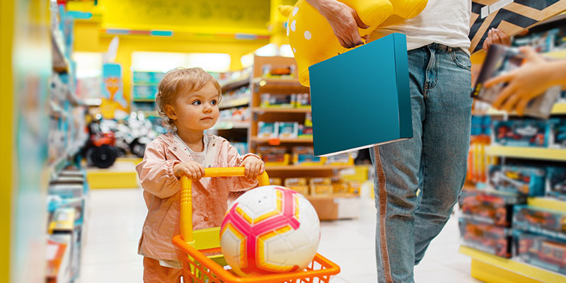 Illustration of a toy store with a focus on a sign saying 'How a Bizcap Loan Breathed Life Into Marco’s Dying Toy Store'.