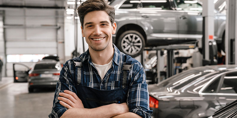 Happy mechanic who overcame cash flow issues with a Bizcap loan.