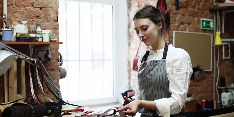 Worker wakling confidently into the future with help through Bizcap lending.
