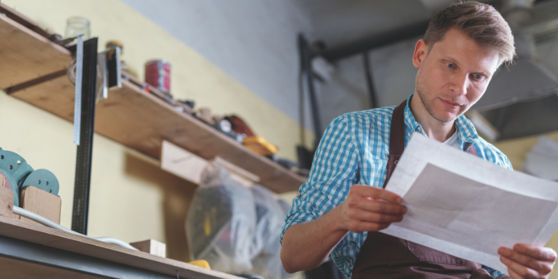 Small business owner reviewing his business loan application